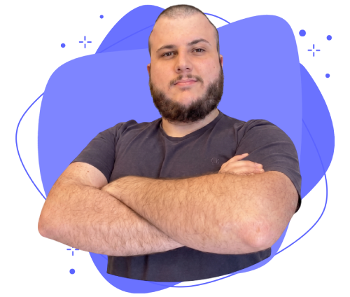 A man in a blue shirt with a happy expression